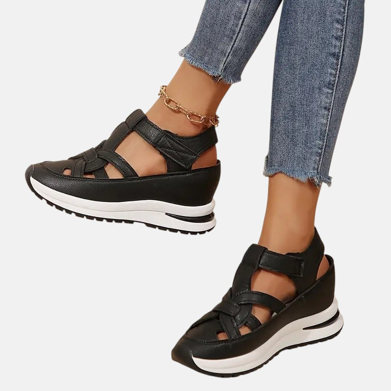 White Aveta™ orthopedic sandals by THE WHITMORE FAMILY featuring supportive straps and cushioned soles for comfort.