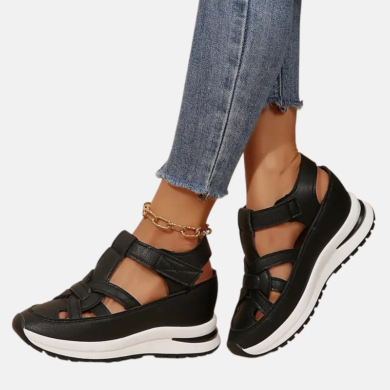 White Aveta™ orthopedic sandals by THE WHITMORE FAMILY with cushioned straps and supportive sole for comfortable wear.