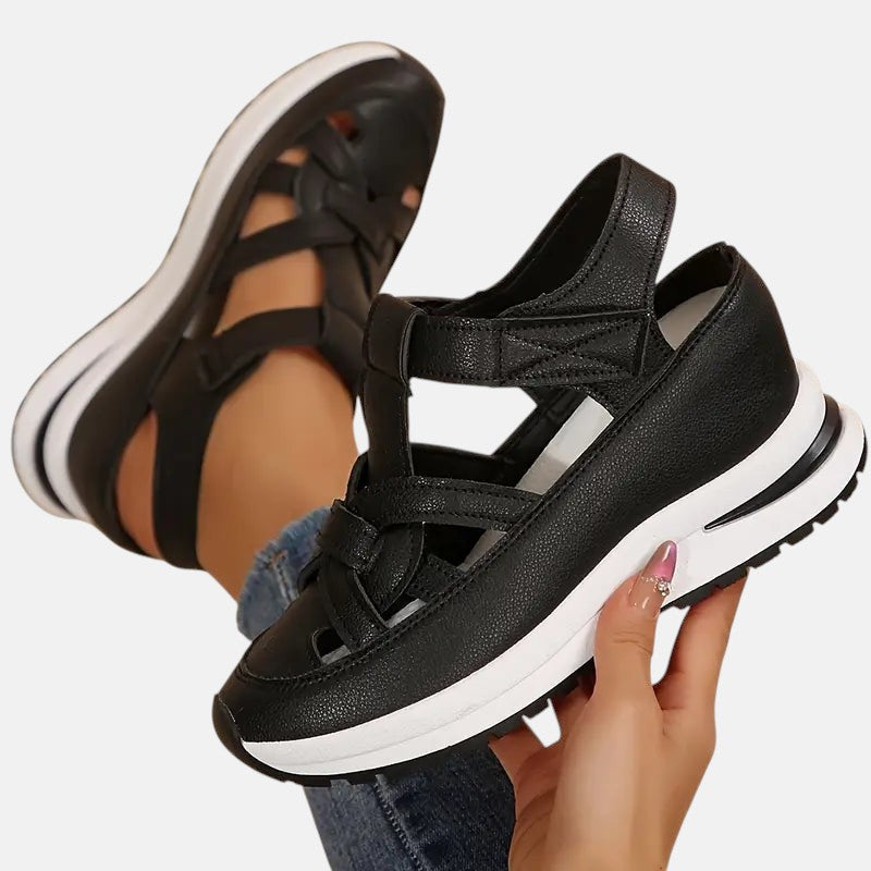White Aveta™ orthopedic sandals by THE WHITMORE FAMILY featuring supportive straps and cushioned soles for comfort.