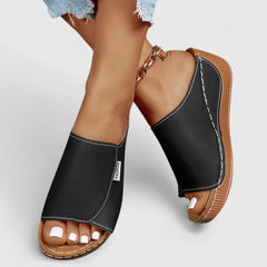 White Celestria™ orthopedic sandals by THE WHITMORE FAMILY with cushioned straps and supportive soles for comfortable wear.
