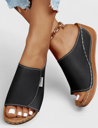 White Celestria™ orthopedic sandals by THE WHITMORE FAMILY with cushioned straps and supportive soles for comfortable wear.