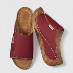 White Celestria™ orthopedic sandals by THE WHITMORE FAMILY with cushioned straps and supportive soles for comfort.