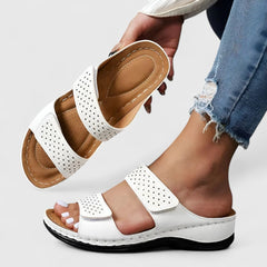 White Karyssa™ orthopedic sandals by THE WHITMORE FAMILY, featuring cushioned straps and supportive sole for comfort.