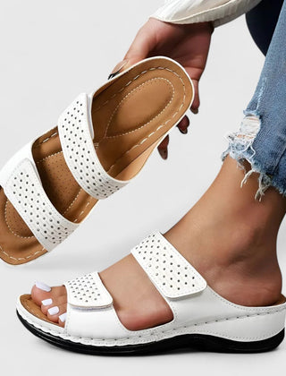 White Karyssa™ orthopedic sandals by THE WHITMORE FAMILY, featuring cushioned straps and supportive sole for comfort.