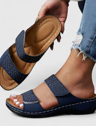 White Karyssa™ orthopedic sandals by THE WHITMORE FAMILY, featuring supportive straps and cushioned soles for comfort.