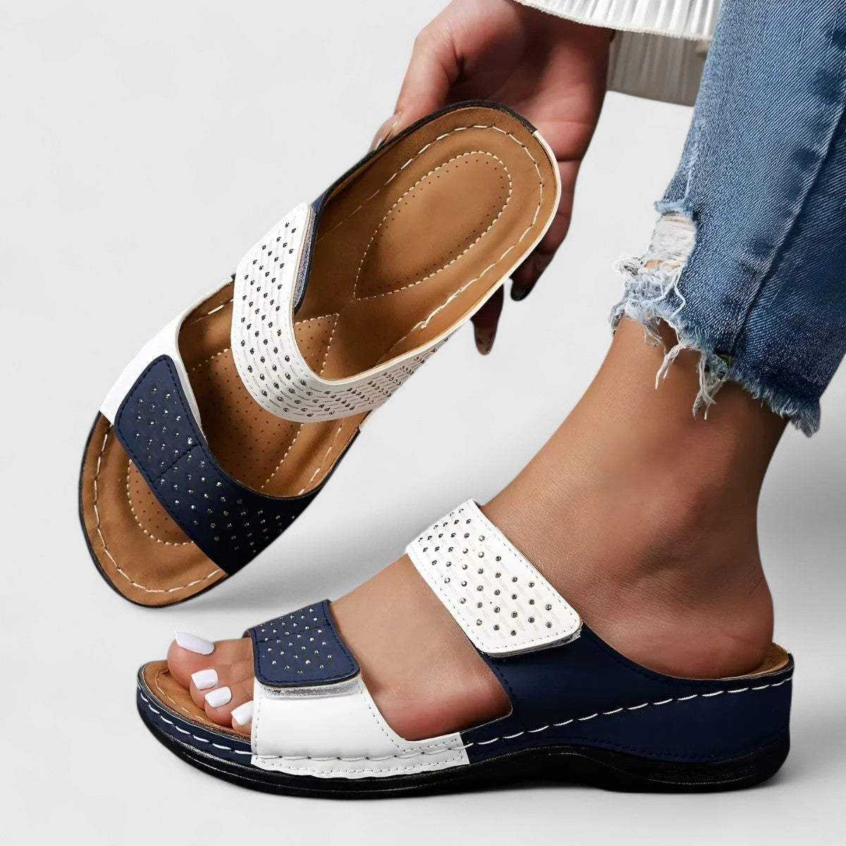 White Karyssa™ orthopedic sandals by THE WHITMORE FAMILY with cushioned soles and supportive straps for comfortable wear.