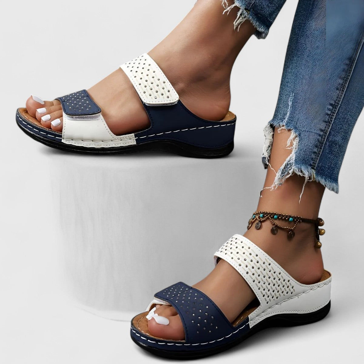 Karyssa™ orthopedic sandals by THE WHITMORE FAMILY featuring white straps and cushioned footbed for comfortable support