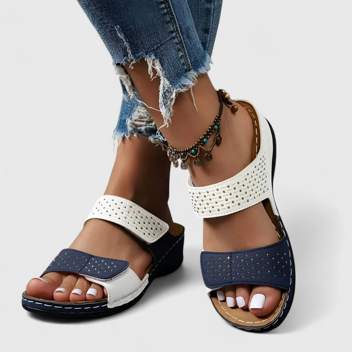 Karyssa™ orthopedic sandals in white with cushioned straps and supportive soles, designed for comfort and style.