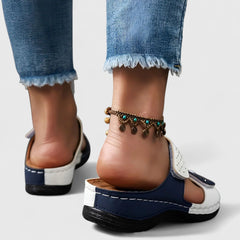 White Karyssa™ Orthopedic Sandals by THE WHITMORE FAMILY with cushioned soles and supportive straps, designed for comfort.