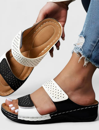 White Karyssa™ orthopedic sandals by THE WHITMORE FAMILY with cushioned straps and supportive soles, designed for comfort and style.