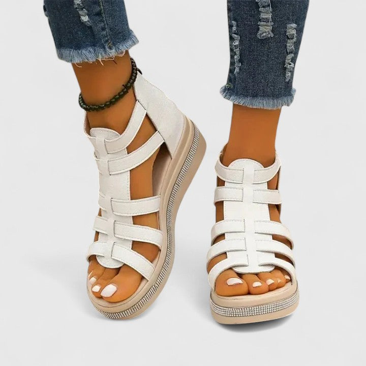 White Kendall™ orthopedic strass sandals with decorative rhinestones and adjustable straps, designed for comfort and style.