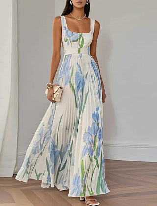 White and blue floral A-line maxi dress from THE WHITMORE FAMILY's Grace collection, featuring a flowing, elegant design.