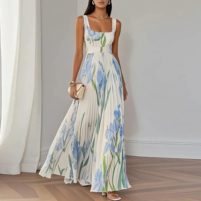 White and blue floral A-line maxi dress from THE WHITMORE FAMILY's Grace collection, featuring a flowing, elegant design.