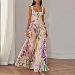 White and blue floral A-line maxi dress by THE WHITMORE FAMILY, featuring a flowing silhouette and elegant design.