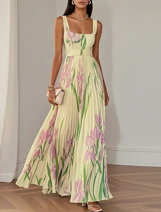 Grace floral A-line maxi dress by THE WHITMORE FAMILY featuring white and blue fabric, flowing style, and elegant design.