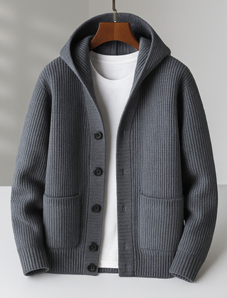 White Ramsay™ Modern Cardigan by THE WHITMORE FAMILY displayed on a hanger, showcasing its sleek design and soft fabric.