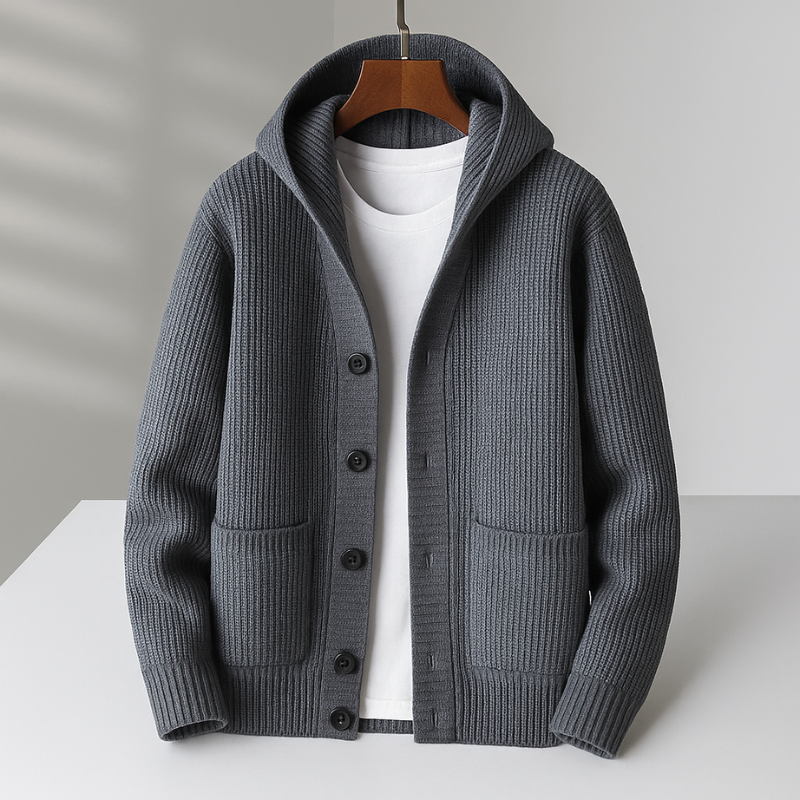 White Ramsay™ Modern Cardigan by THE WHITMORE FAMILY displayed on a hanger, showcasing its sleek design and soft fabric.