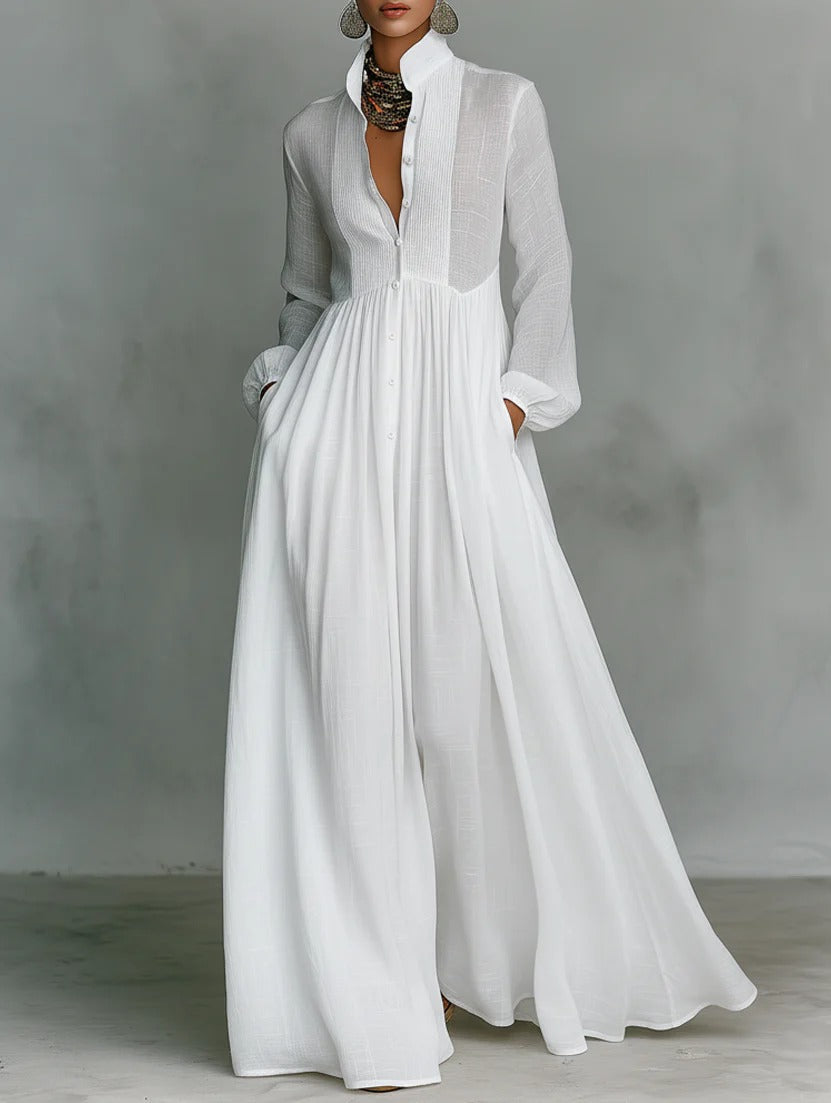 White Barbara flowy button-front maxi dress by THE WHITMORE FAMILY, with lightweight fabric and elegant, flowing silhouette.