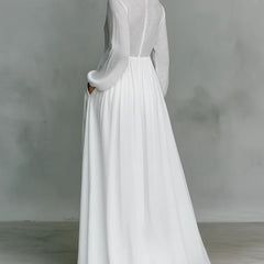 White Barbara maxi dress by THE WHITMORE FAMILY featuring a flowing fabric and button-front design.