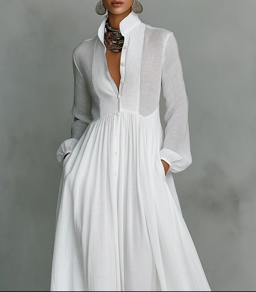 White Barbara maxi dress by THE WHITMORE FAMILY featuring a flowing design and button-front style.