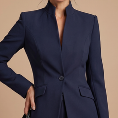 White Delta structured tailored suit with a stand collar, featuring a sleek, modern design and precise tailoring from THE WHITMORE FAMILY.