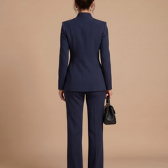 White Delta structured stand collar tailored suit by THE WHITMORE FAMILY, featuring a sleek fit and sharp lapels for formal wear.