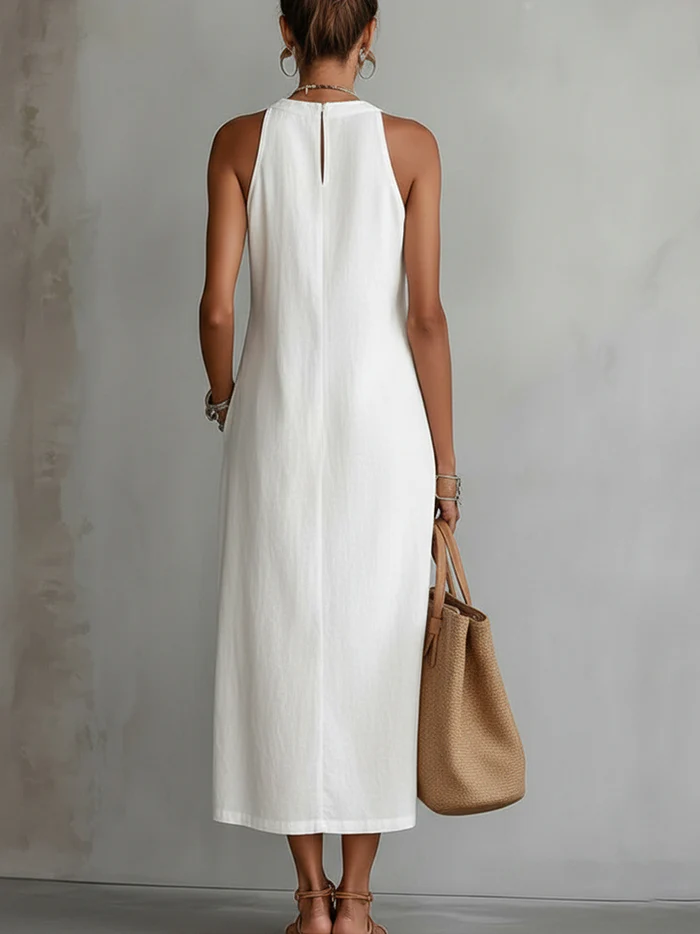 Julie sleeveless lace midi dress by THE WHITMORE FAMILY, white with intricate lace details and a fitted silhouette.