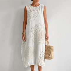 White Oplena casual sleeveless dress by THE WHITMORE FAMILY, featuring a relaxed fit and simple, elegant design.