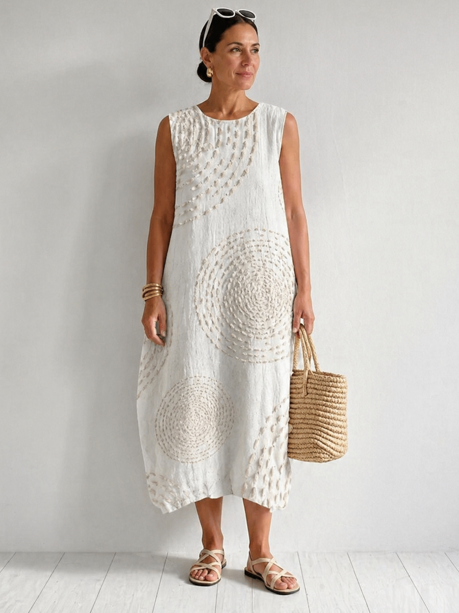 White Oplena casual sleeveless dress by THE WHITMORE FAMILY, featuring a relaxed fit and simple, elegant design.