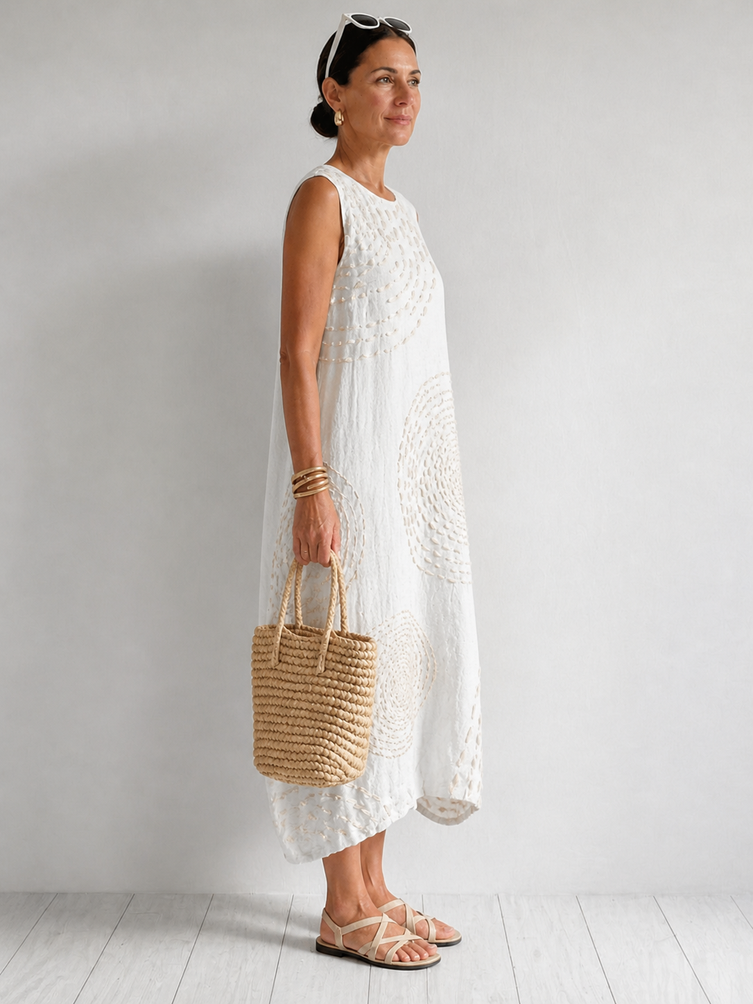 Casual sleeveless dress by THE WHITMORE FAMILY in white, featuring a relaxed fit and simple style for everyday wear.