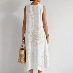 White Oplena casual sleeveless dress by THE WHITMORE FAMILY, featuring a relaxed fit and simple, elegant design for warm weather.