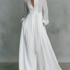 White Serena flowing maxi dress by THE WHITMORE FAMILY with button-front design, lightweight and elegant for summer wear.