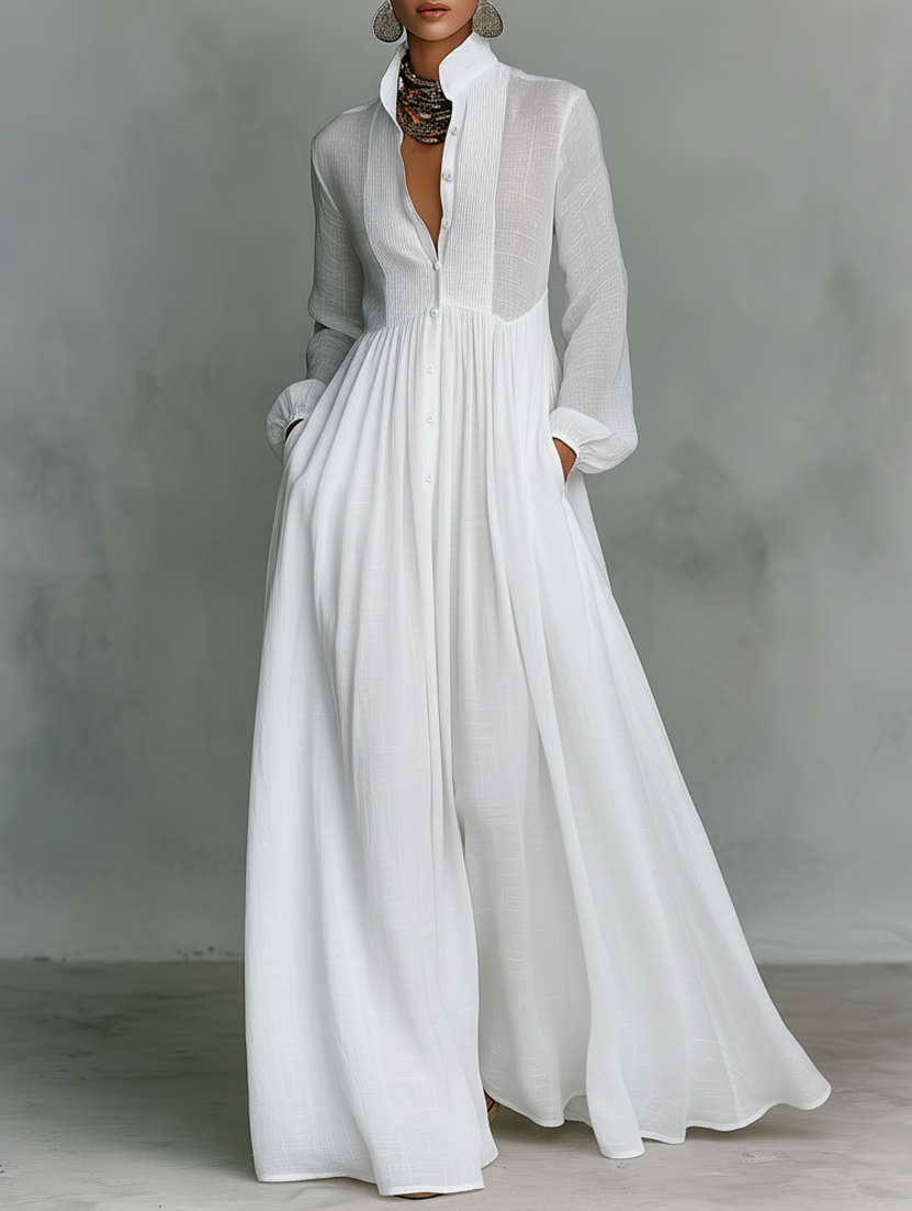 White Serena flowing maxi dress by THE WHITMORE FAMILY with button-front design, lightweight and elegant for summer wear.