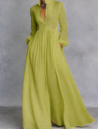 White Serena maxi dress by THE WHITMORE FAMILY featuring a flowing design and button-front closure.