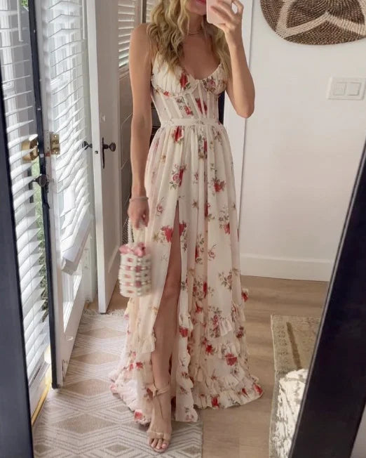Scarlett romantic floral dress by THE WHITMORE FAMILY displayed on a hanger with a floral pattern and lightweight fabric.