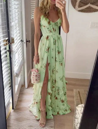 Scarlett Romantic Floral Dress by THE WHITMORE FAMILY, featuring a flowy fabric with a floral print on a white background.