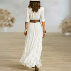 White Lily chic maxi dress by THE WHITMORE FAMILY, flowing fabric and elegant design perfect for summer occasions.