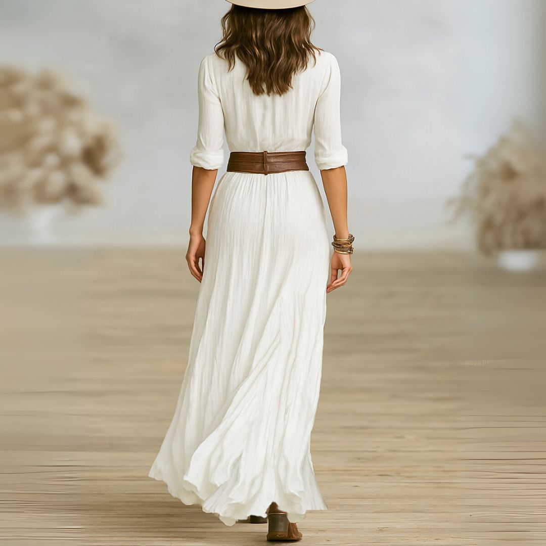 White Lily chic maxi dress by THE WHITMORE FAMILY, flowing fabric and elegant design perfect for summer occasions.