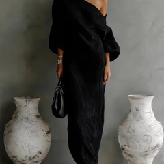 White Nelle™ Elegant Maxi Dress by THE WHITMORE FAMILY, flowing fabric, V-neckline, and ankle-length silhouette.