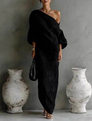 White Nelle™ Elegant Maxi Dress by THE WHITMORE FAMILY, flowing fabric, V-neckline, and ankle-length silhouette.