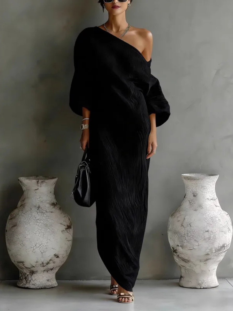 White Nelle™ Elegant Maxi Dress by THE WHITMORE FAMILY, flowing fabric, V-neckline, and ankle-length silhouette.