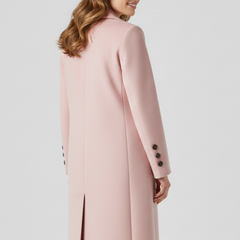 Beige women coat with lapel collar and button closure by THE WHITMORE FAMILY, shown on a model.