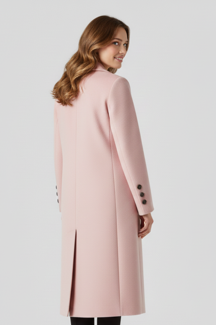 Beige women coat with lapel collar and button closure by THE WHITMORE FAMILY, shown on a model.