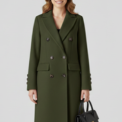Beige women’s coat with lapel collar and button closure by THE WHITMORE FAMILY, shown on a model.