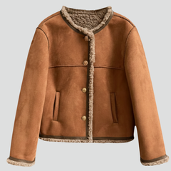 Women’s brown jacket by THE WHITMORE FAMILY featuring button closure and stylish trim edging, casual and versatile outerwear.