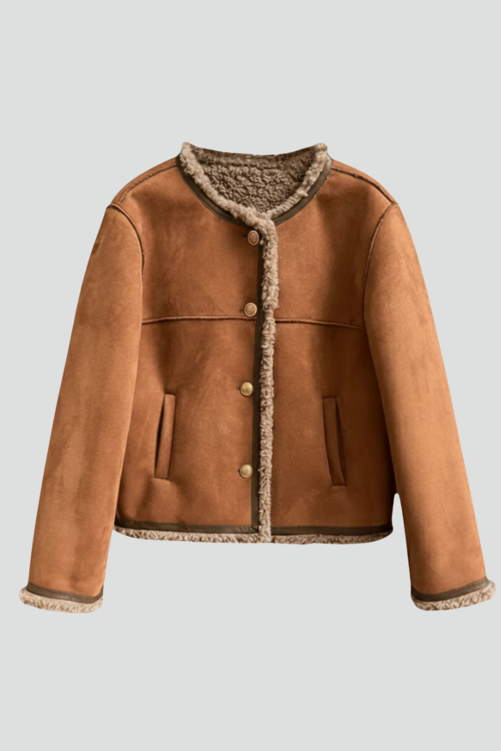 Women’s brown jacket by THE WHITMORE FAMILY featuring button closure and stylish trim edging, casual and versatile outerwear.