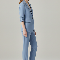 Women’s blazer set with notched lapel and straight-leg trousers, stylish formal wear from THE WHITMORE FAMILY.