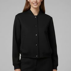 Beige women’s bomber jacket from THE WHITMORE FAMILY featuring a baseball collar and snap buttons, styled for casual wear.