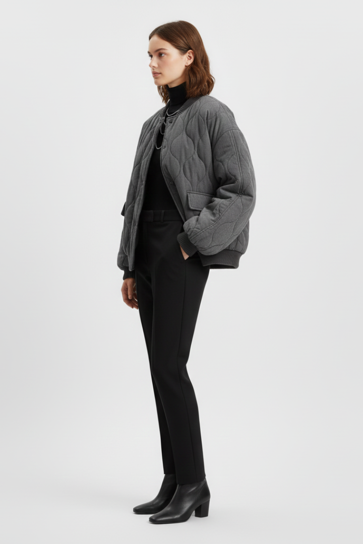 Women's grey bomber jacket by THE WHITMORE FAMILY featuring snap closure and quilted surface, styled for a casual look.