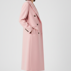 Beige women’s coat with lapel collar and button fastening by THE WHITMORE FAMILY, shown on a model.